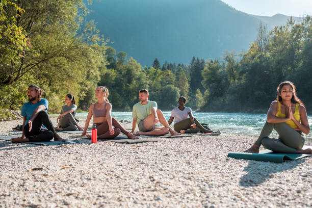istock Multicultural Yoga Harmony by the Riverside 1935986026