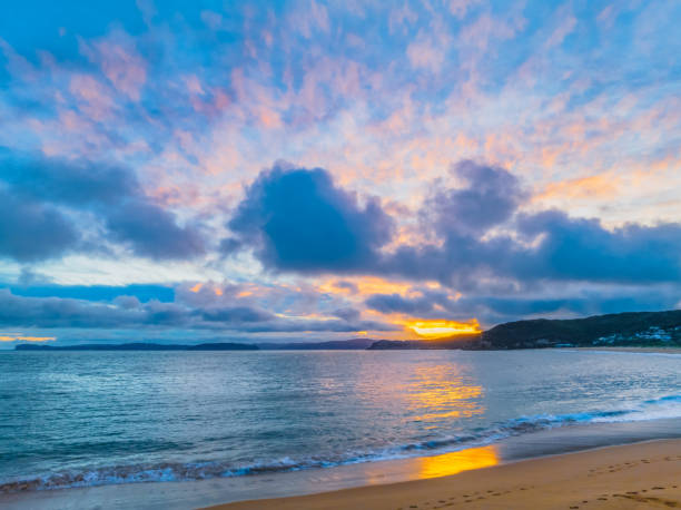istock High cloud sunset over the sea and beach 1936008425