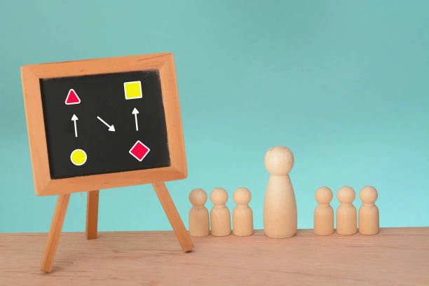 istock group of business individuals engrossed in assembling a jigsaw puzzle, highlighting the intricate and interconnected nature of their strategic thinking 1936012666