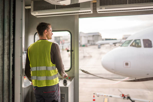 istock Young Caucasian Male Using Controls While Working At The Airport 1936015291