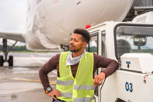 istock Hispanic Male Looking Away While Working Outdoors At The Airport 1936015321
