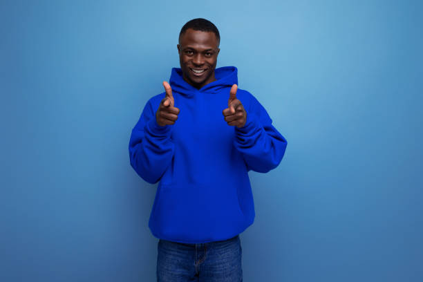 istock fashionable authentic young african man in sweatshirt on studio background with copy space 1936019163