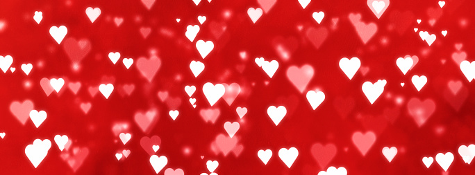 valentines day - defocused white hearts background on red background - february 14