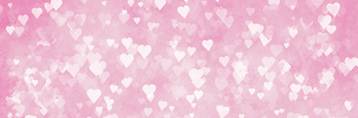 valentines day - defocused white hearts background on pink background - february 14