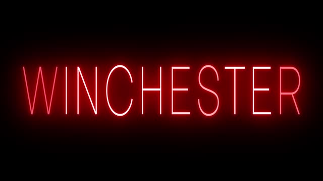 Glowing and blinking red retro neon sign for WINCHESTER