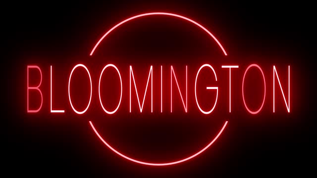 Glowing and blinking red retro neon sign for BLOOMINGTON