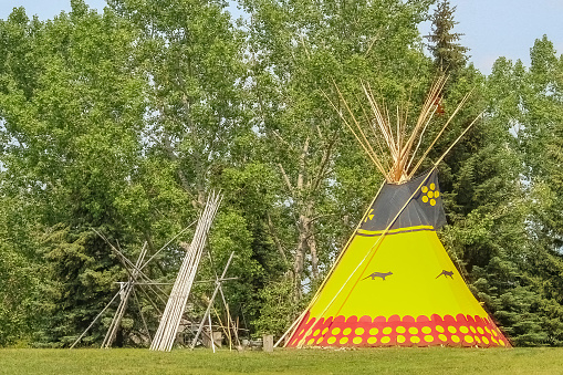 Calgary, Alberta, Canada. Jul 09, 2015. A tipi or tepee a conical lodge tent that is distinguished with smoke flaps at the top of the structure, and historically made of animal hides.