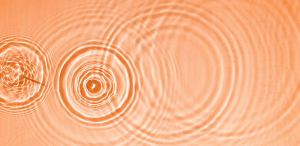 istock Circles and waves on blue water in sunlight 1936118778