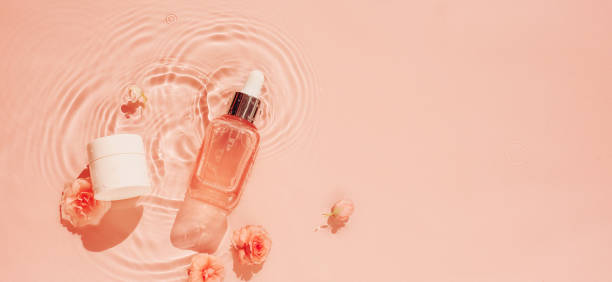 istock Spring water background with flowers and cosmetics 1936118779