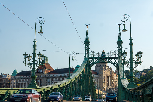 The liberty bridge framing the Danubius Hotel Gellért in Buda, Budapest