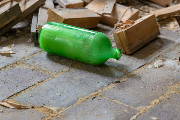 istock old green bottle in an abandoned house 1936133255
