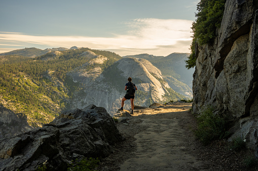 Woman Takes in the View of North Dome from Four Mile Trail in Yosemite National Park