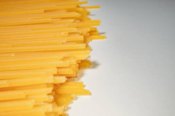 Natural organic healthy pasta, food macro texture background, representing a healthy lifestyle, wellbeing and body care, top view with a large copy space area