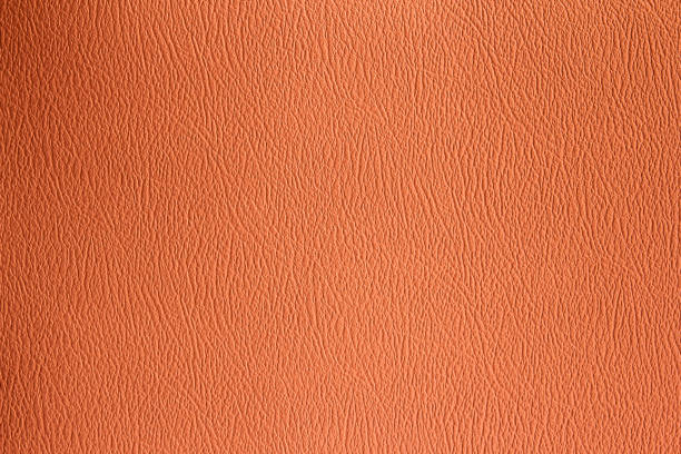 istock Orange background of orange leather sheet texture 1936159523