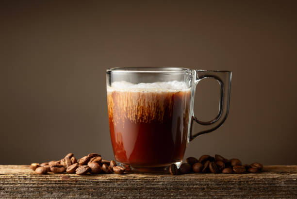 istock Coffee and chocolate drink with cream on a brown background. 1936172865