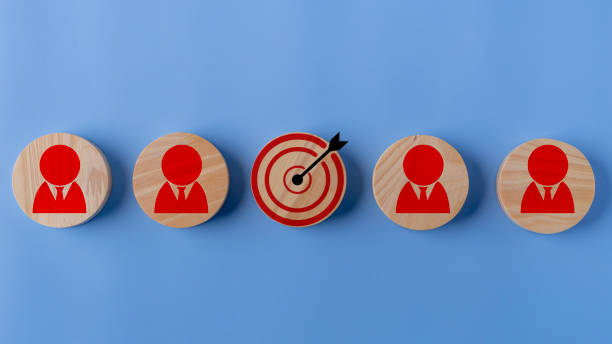istock Concept of achieving goals by cooperating with team members with a human icon for customer focus target group and customer relation management concept. 1936190015