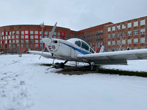 Arctic landscape with landing plane on airport.