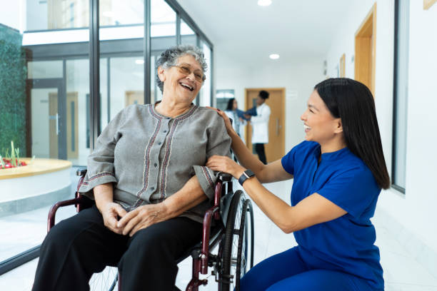 istock Friendly nurse interacts with her patient Interaction in the lobby 1936223962