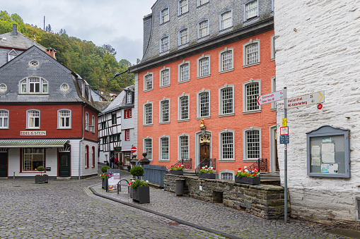 Monschau, Germany - October 12, 2023:  Cityscape of Monschau in autumn colors. Town in western Germany known for its medieval center, with half-timbered houses and narrow cobblestone streets.