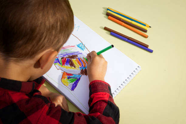 istock A child draws an abstract drawing 