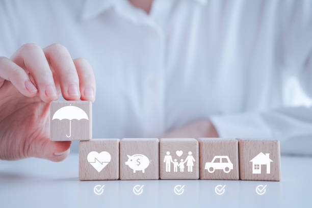 istock Insurance concept. Protection against a possible eventuality. Hand holding umbrella security symbol and checklist for all coverage with house, car, life, travel, business and health. 1936250775