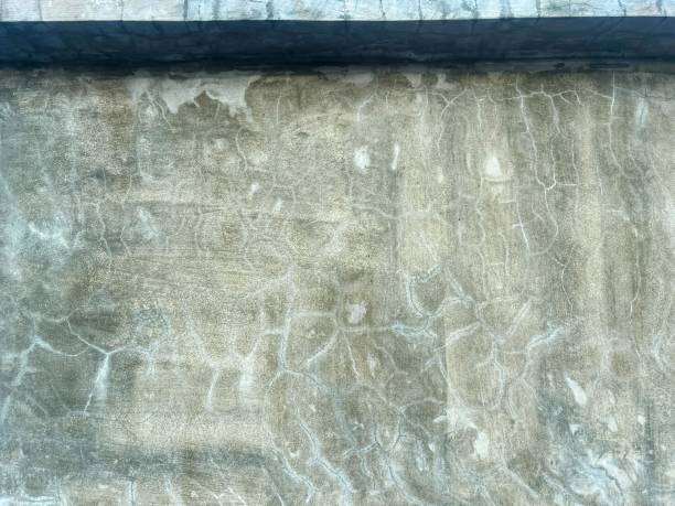 istock a photography of a concrete wall with a black frame and a black window. 1936257698