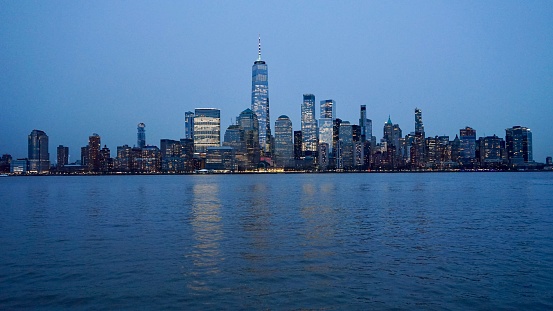 A dusk skyline picture of downtown Manhattan taken from a Jersey City viewpoint.