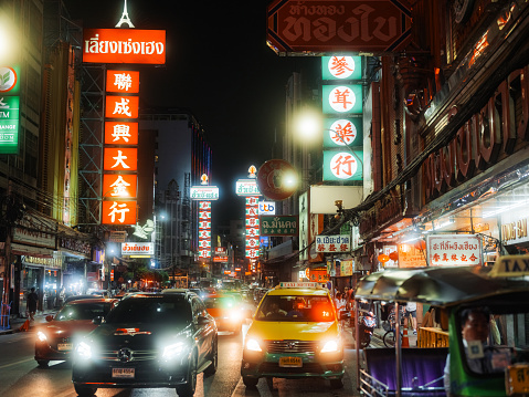 Traffic in crowded  Chinatown street in Bangkok at night