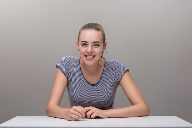istock Hands clasped, woman's chuckle radiates infectious happiness 1936365744