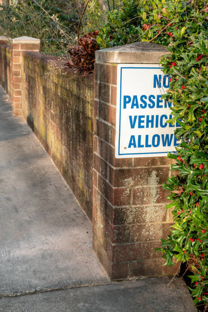 istock No passenger vehicles allowed sign on a brick wall. 1936368384