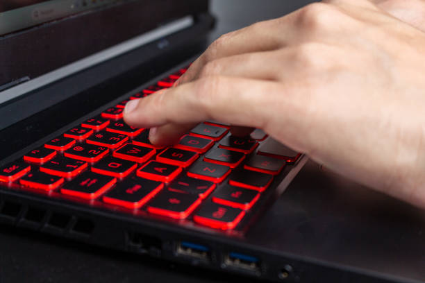 istock Close up on person typing on black laptop keyboard 1936406711