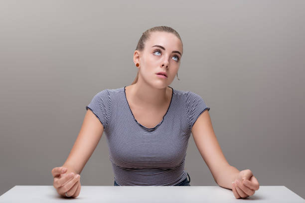 istock Woman's clenched fists suggest deep contemplative frustration 1936412966