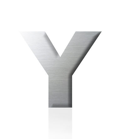 Close-up of three-dimensional silver alphabet letter Y on white background.