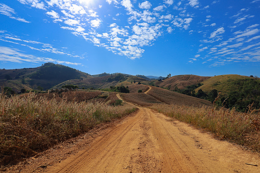 Dusty mountain road, beautiful sky, northern Thailand