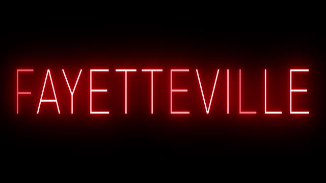 Glowing and blinking red retro neon sign for FAYETTEVILLE