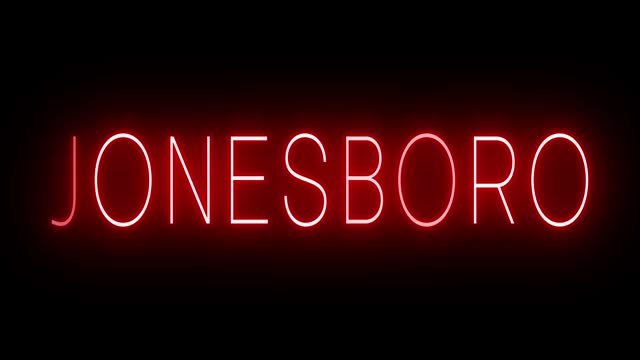 Glowing and blinking red retro neon sign for JONESBORO