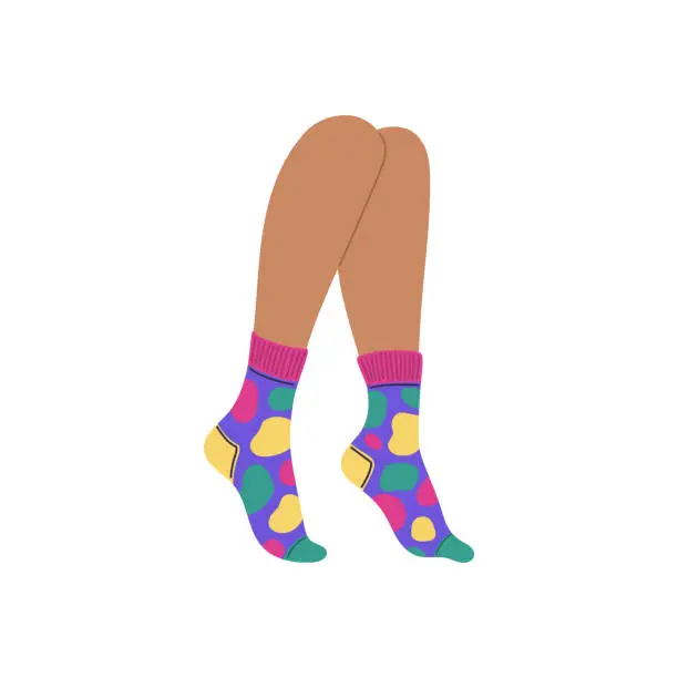 Vector illustration of Legs dressed in socks decorated with colorful bright spots, vector children's socks with cool print, stylish footwear
