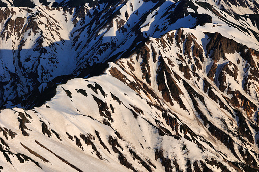 Snow-covered ridgeline seen from Mt. Yarigatake in the Northern Alps in Japan
