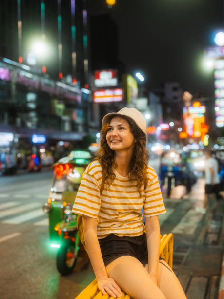 istock Woman exploring Chinatown in Bangkok at night 1936586356