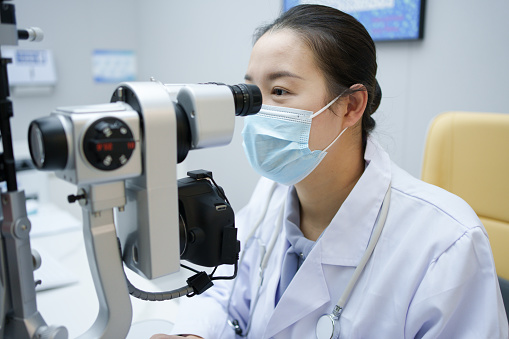 Doctor checking eyesight