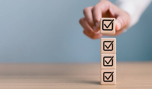 istock Checklist concept, business person checklist tick answer sign in checkbox, validation online questionnaire quality control document, man use pen to tick correct sign mark in checkbox form. 1936605006