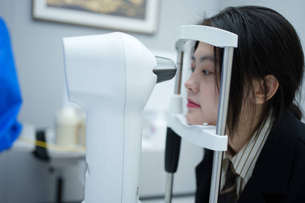 istock Young girl having retina tested 1936614330