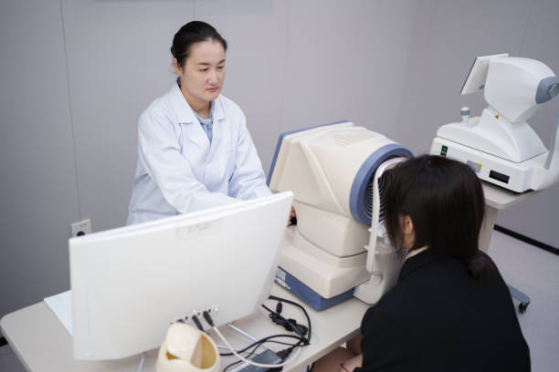 istock Doctor examining patient's eyes 1936615376