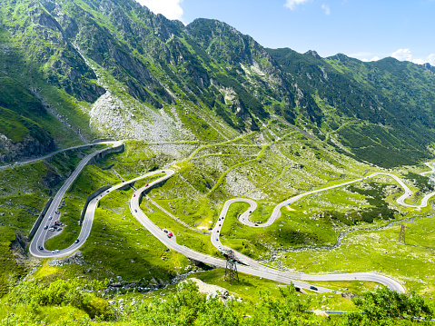 Unusual winding road high in the mountains on a summer day