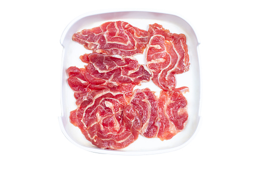 Fresh raw offal sliced on square plate isolated on white background, hot pot ingredients.