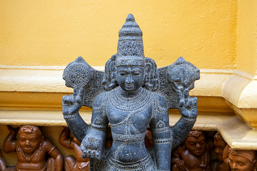 Ancient statue at the entrance of Gangaramaya Temple, it is one of the most important temples in Colombo, Sri Lanka