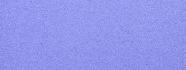 istock Texture of old light blue paper background, macro. Very peri kraft cardboard. 1936670277