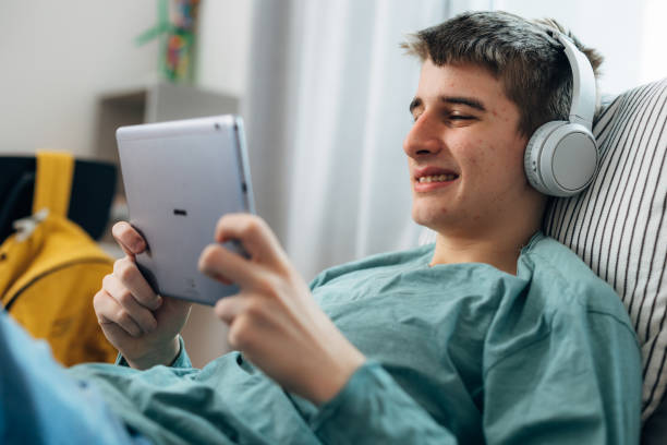 istock teenager boy at home 1936671186
