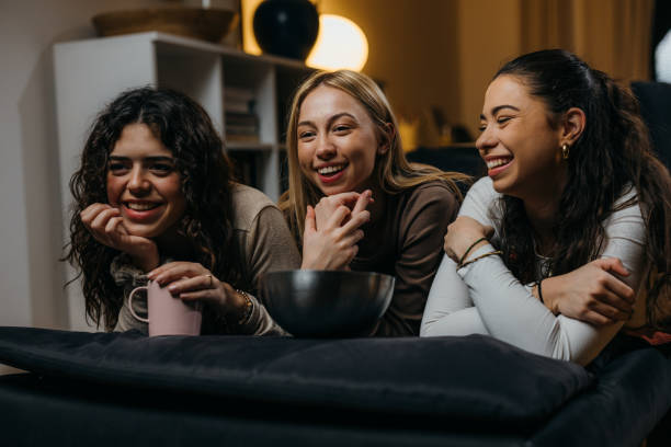 istock female friends at home 1936671344