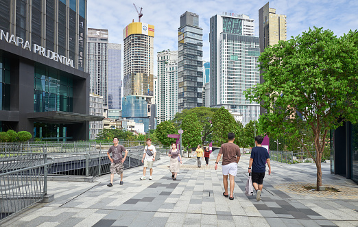 Kuala Lumpur, Malaysia - Jan 14, 2024 : People walking around exploring The TRX City Park at the The Exchange TRX